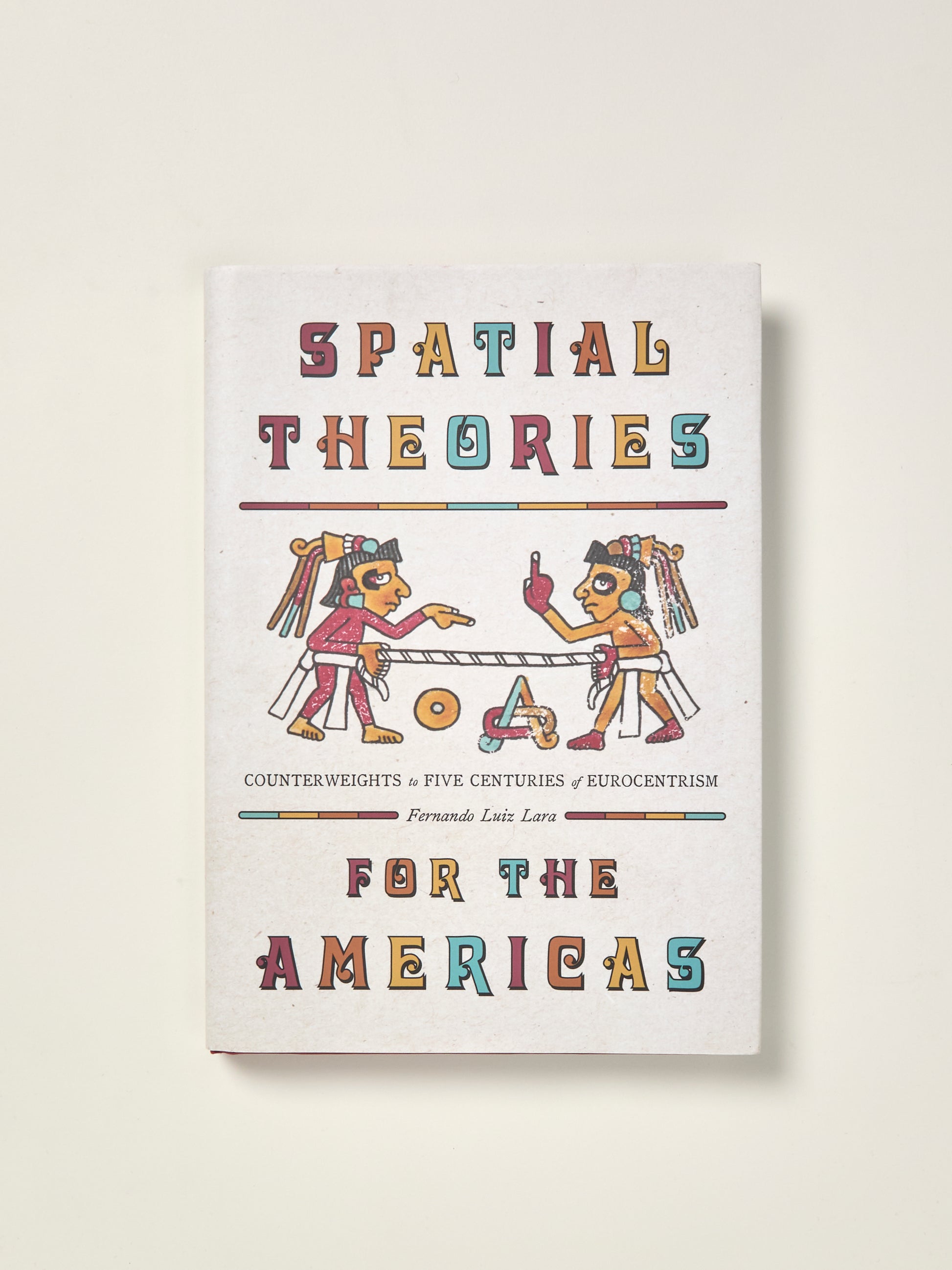 Book cover of 'Spatial Theories for the Americas' with colorful text and illustrations on a white background